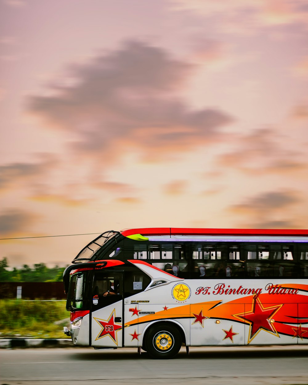 Luxury tour coach on a European route at sunset