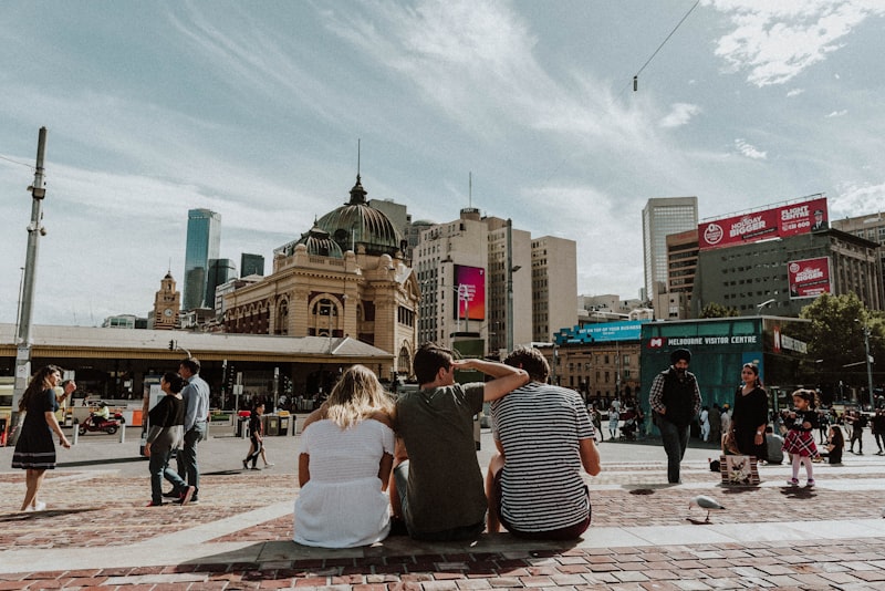 Travellers gathered in a European city square